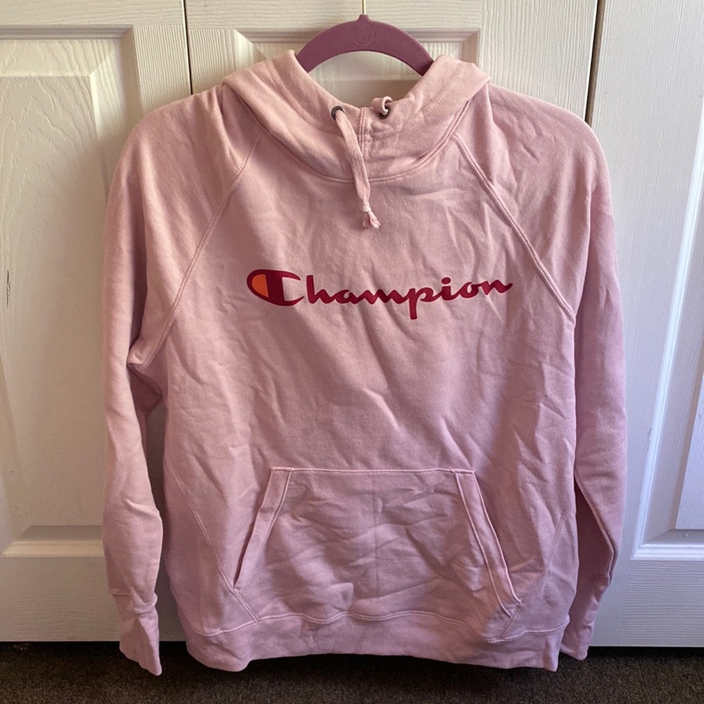 A pink champion hoodie